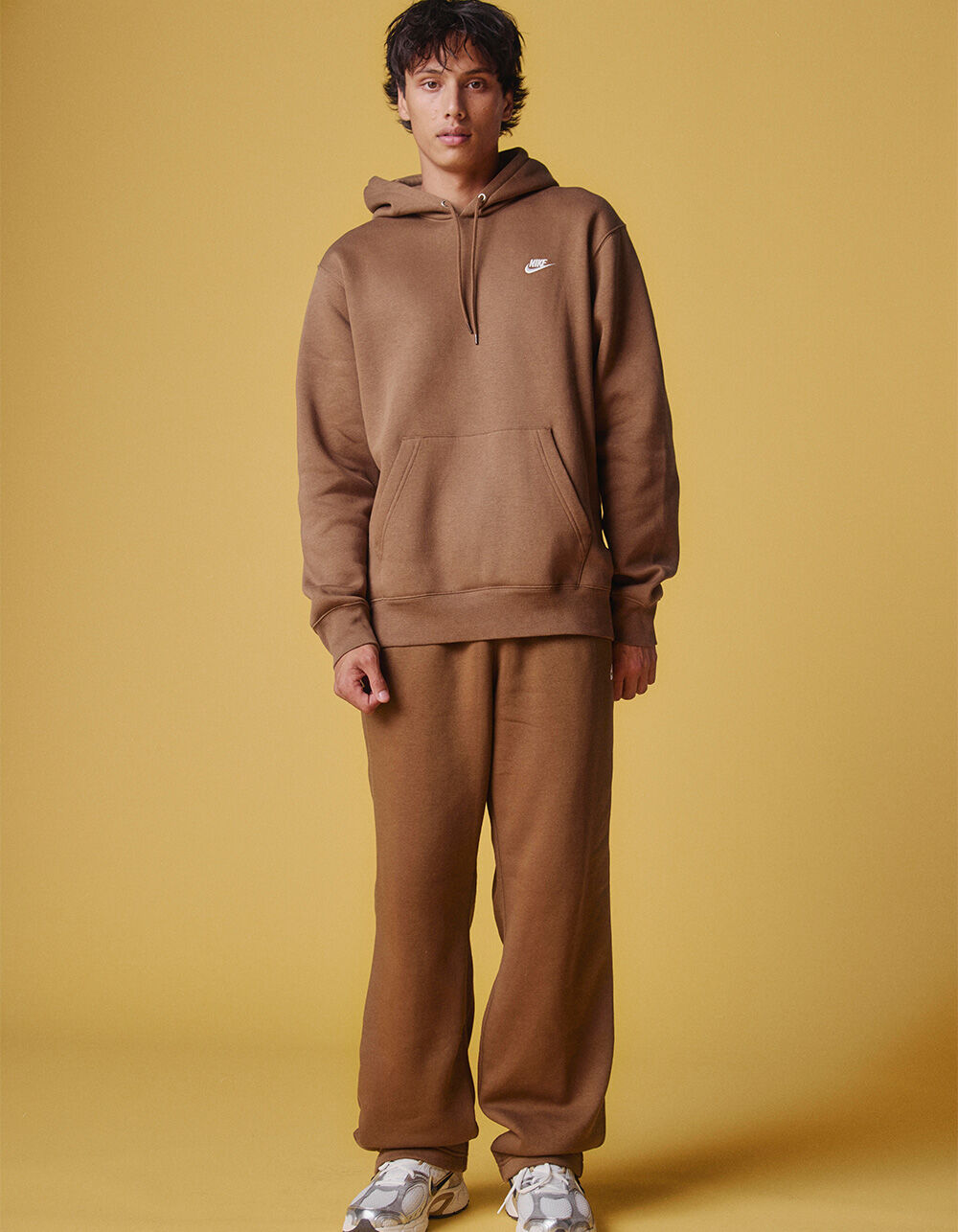 nike essential joggers brown