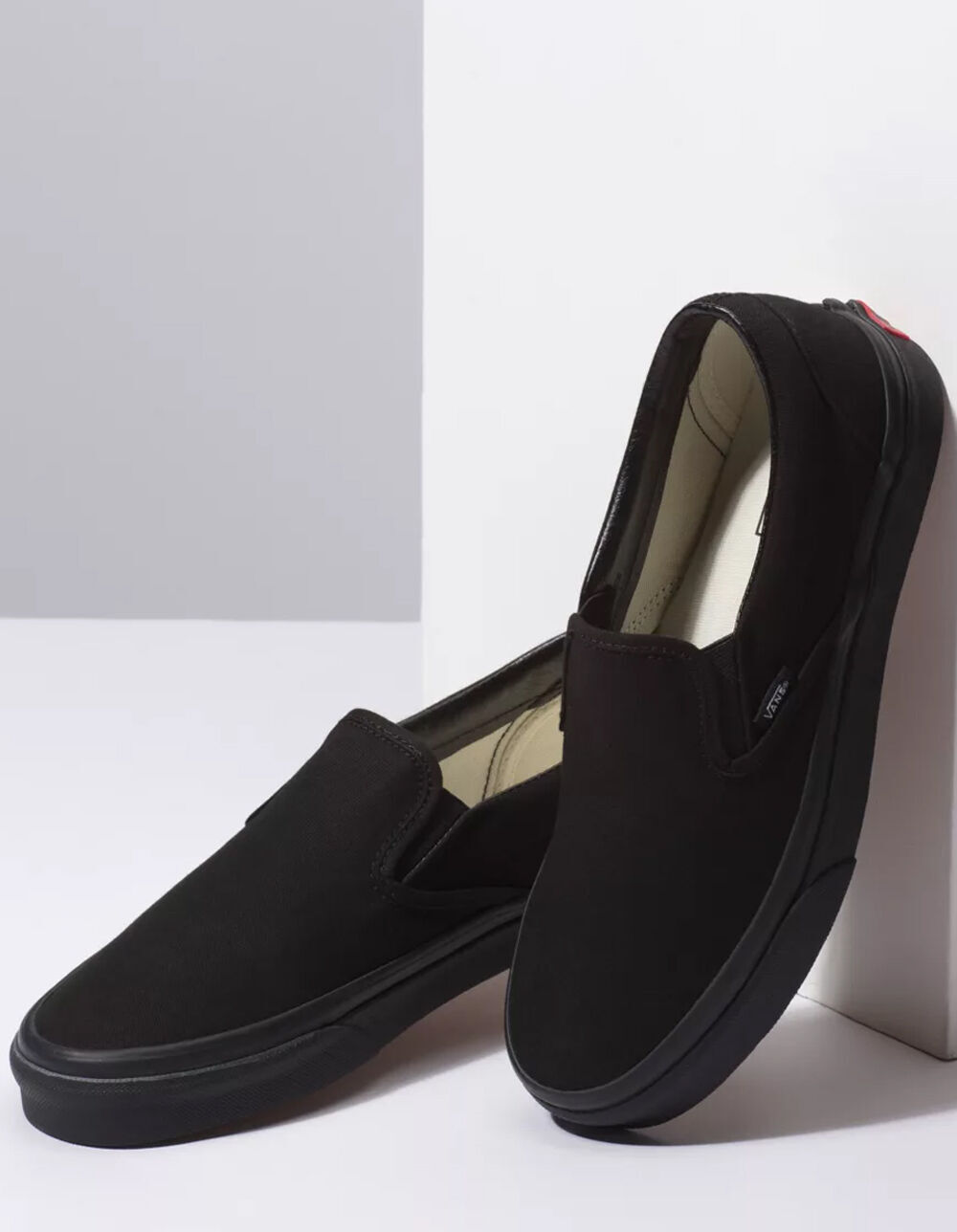 slip on full black vans