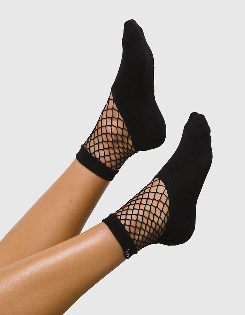 Dig Those Fishnets Out of Your Sock Drawer Because They're 100% Back